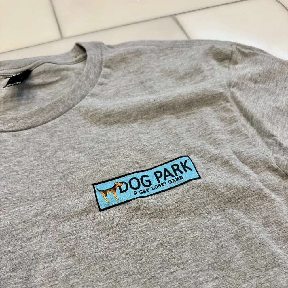 Dog Park tee on white tile